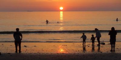 Family on Broad Haven beach at sunset Family on Broad Haven beach at sunset