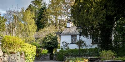 Grasmere village in the Lake District Countryside cottage surrounded by trees
