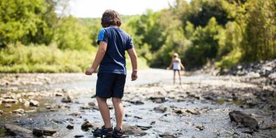 Children playing in river Children-playing-in-river