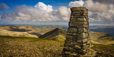 Way point at summit of Helvellyn View over countryside from the top of a mountain