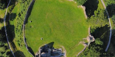 Aerial view of Kendal Castle in the Lake District Aerial view of a castle surrounded by a large circular boundary wall