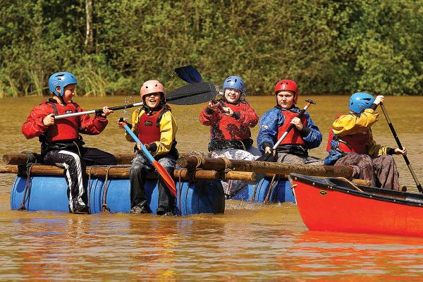 Groups of people on make-shift rafts