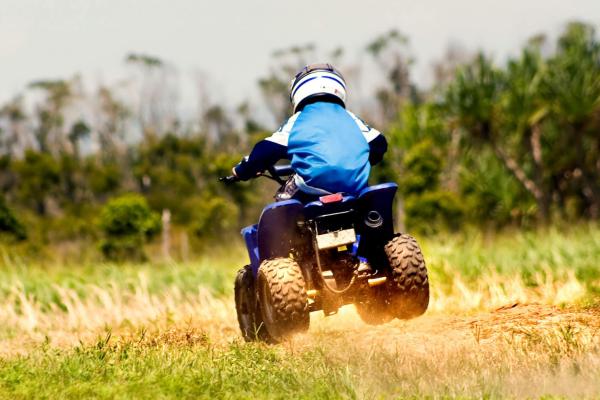 Boy having fun on a quadbike