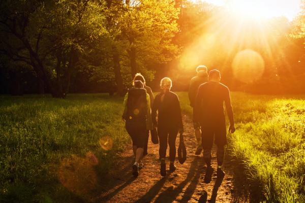 Group of walkers at sunset