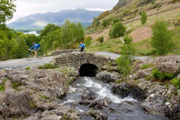 Couple cycling in the Lake District, Cumbria