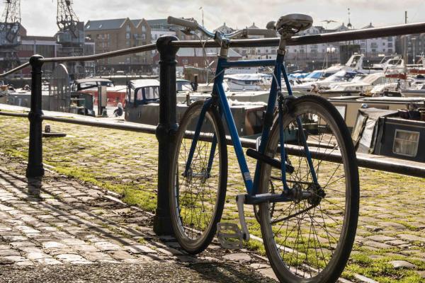 Vintage style bike leaning against a railing