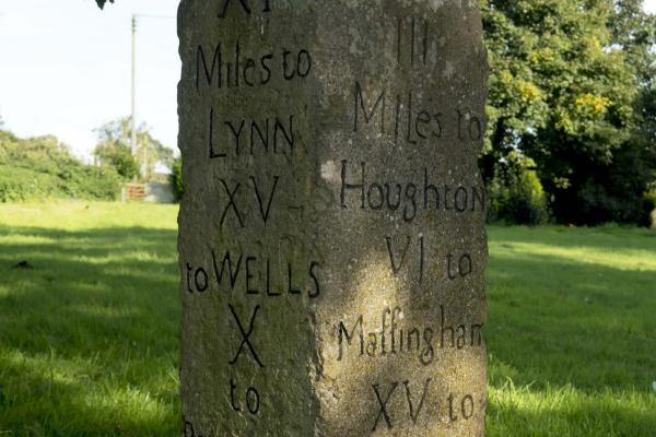 Norfolk milestone showing distance to Houghton and Wells