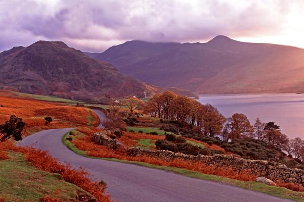 Warm panoramic autumn sunset over Buttermere in the Lake District 