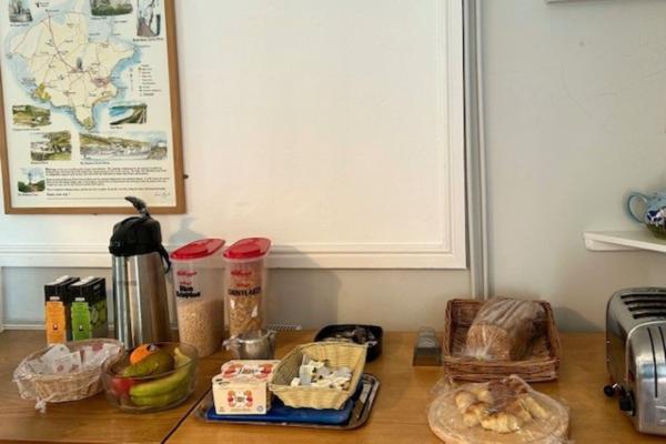 Breakfast buffet on top of a wooden table