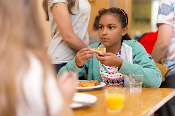 Child eating breakfast on YHA school trip