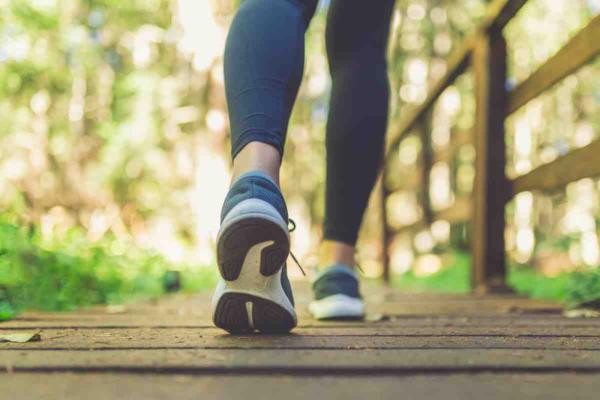 Walking wearing blue trainers