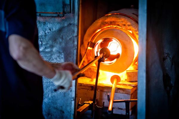 Hot glass in a glassmaker's kiln