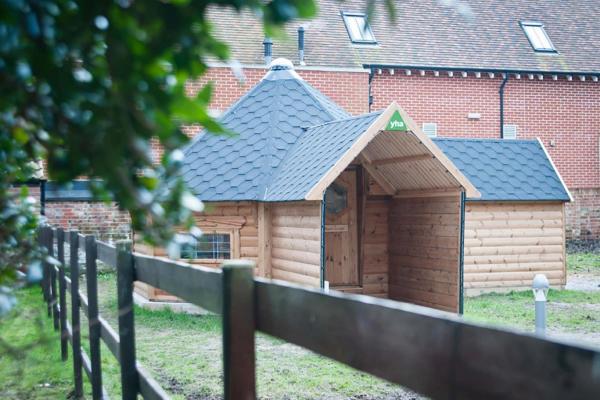 Wooden cabin in the hostel grounds