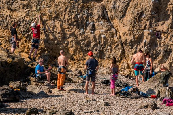 Rock climbers climbing cliff - Break Moor, Somerset