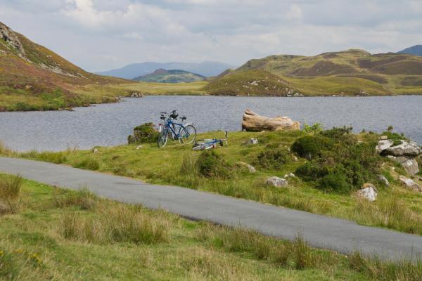 Cycles parked by a lake