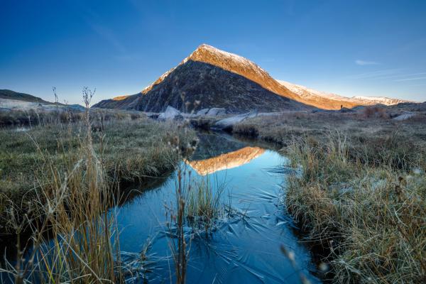 View of Eryri (Snowdonia) with icy stream