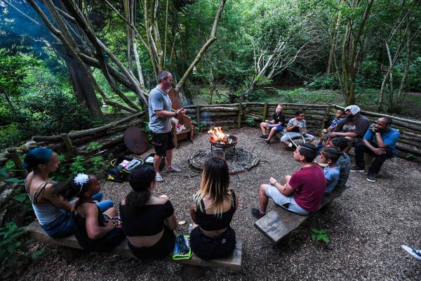 Group sitting round a campfire 