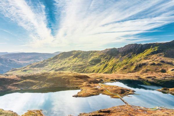 View looking over lake and rolling hills