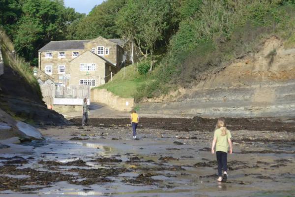 Family on the beach at YHA Boggle Hole