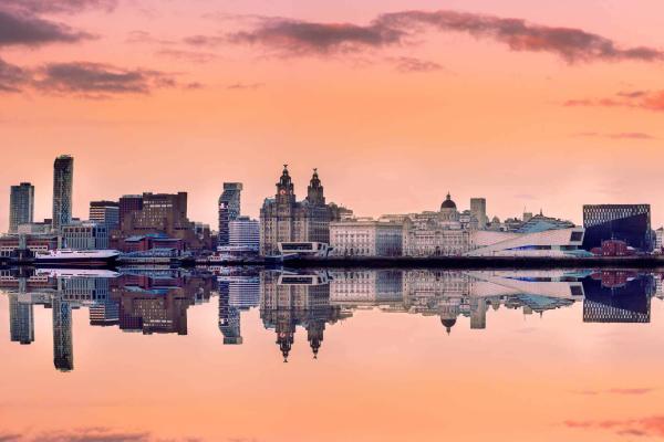 City skyline at sunset with orange skies