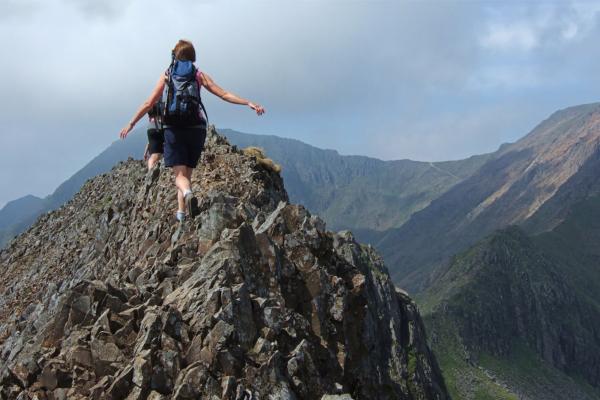 Person climbing a mountain