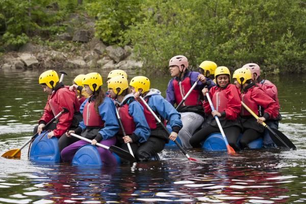 Group on young people making a raft in the Peak District