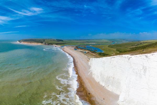 White cliffs overlooking a beach out onto the ocean