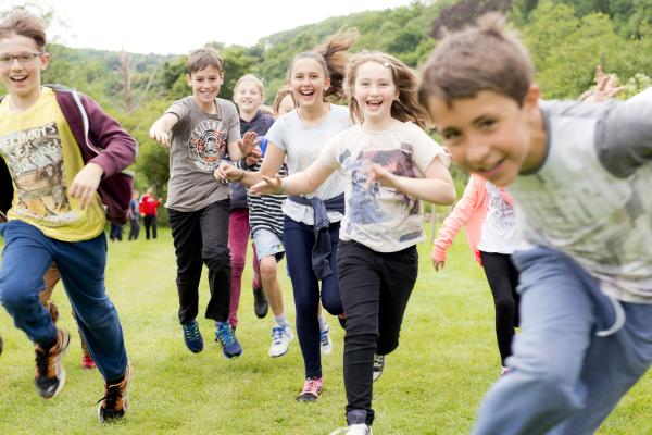 Children running on an Alex Rider residential