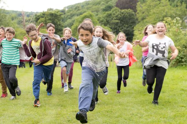 Children running on an Alex Rider residential