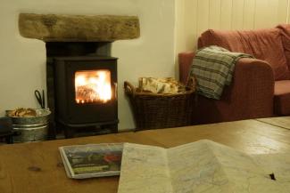 View of map on a coffee table by the fire at YHA Kettlewell