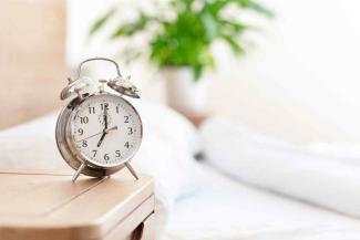 Alarm clock on a bedside table