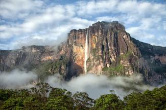 Waterfall surrounded by rocky cliffs