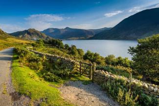 Buttermere public footpath wooden gate on a sunny day