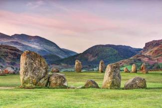 Circle of large stones on a grass field