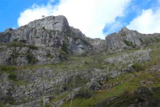 Rocky caves underneath a blue sky