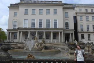 Water fountain in front of a period building