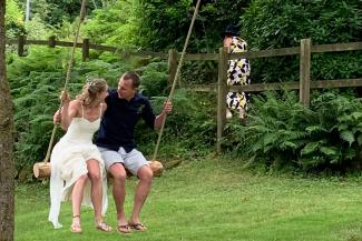 Newlywed couple sat on a tree swingYHA Okehampton Bracken Tor