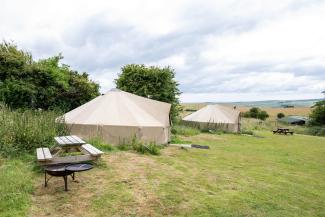 Premium bell tents in a camping field