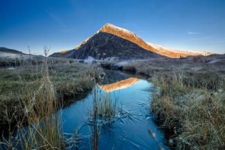 View of Eryri (Snowdonia) with icy stream