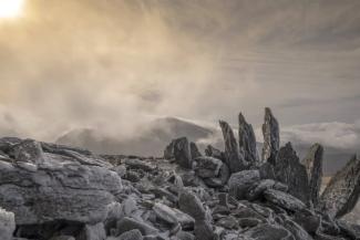 Glyder Fawr Snowdonia winter aerial view with frozen stones and rocks