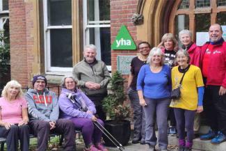 Group of Nordic walkers outside YHA Canterbury