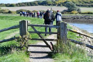 A group of walkers in the South Downs on a sunny day 