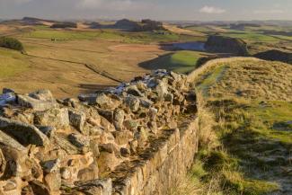 Stone wall winding through the countryside