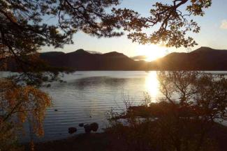 Sun setting over a lake