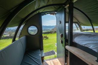 View onto countryside from inside a glamping Landpod