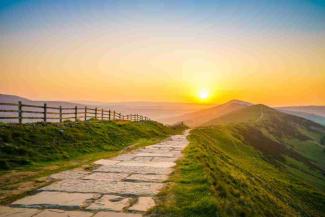 Sunset over a cobbled walkway leading into countryside