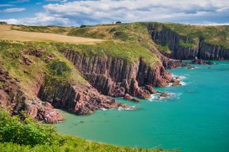 View of cliffs leading into sea, Manorbier