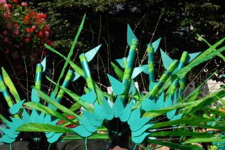 People in green headdresses at Notting hill carnival, London 