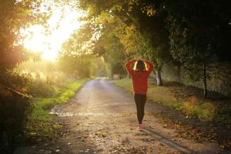 A person walking down the country path