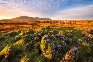 Golden morning light at Ribblehead Viaduct in The Yorkshire Dales National Park